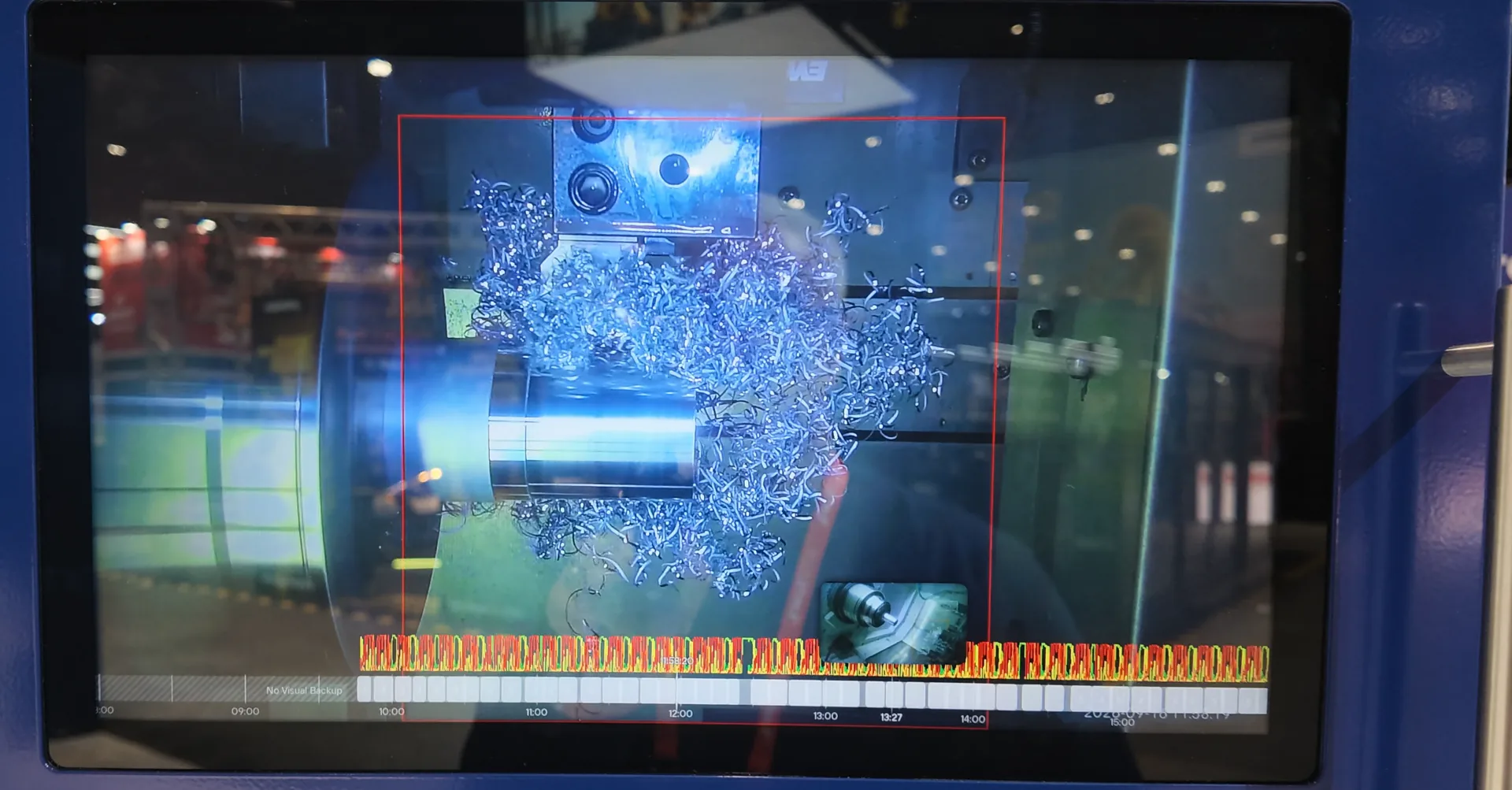 ChipDetect AI live view on the Rotoclear C Pro at IMTS 2026 — detected chips outlined in the machine image, with the ChipReview timeline underneath