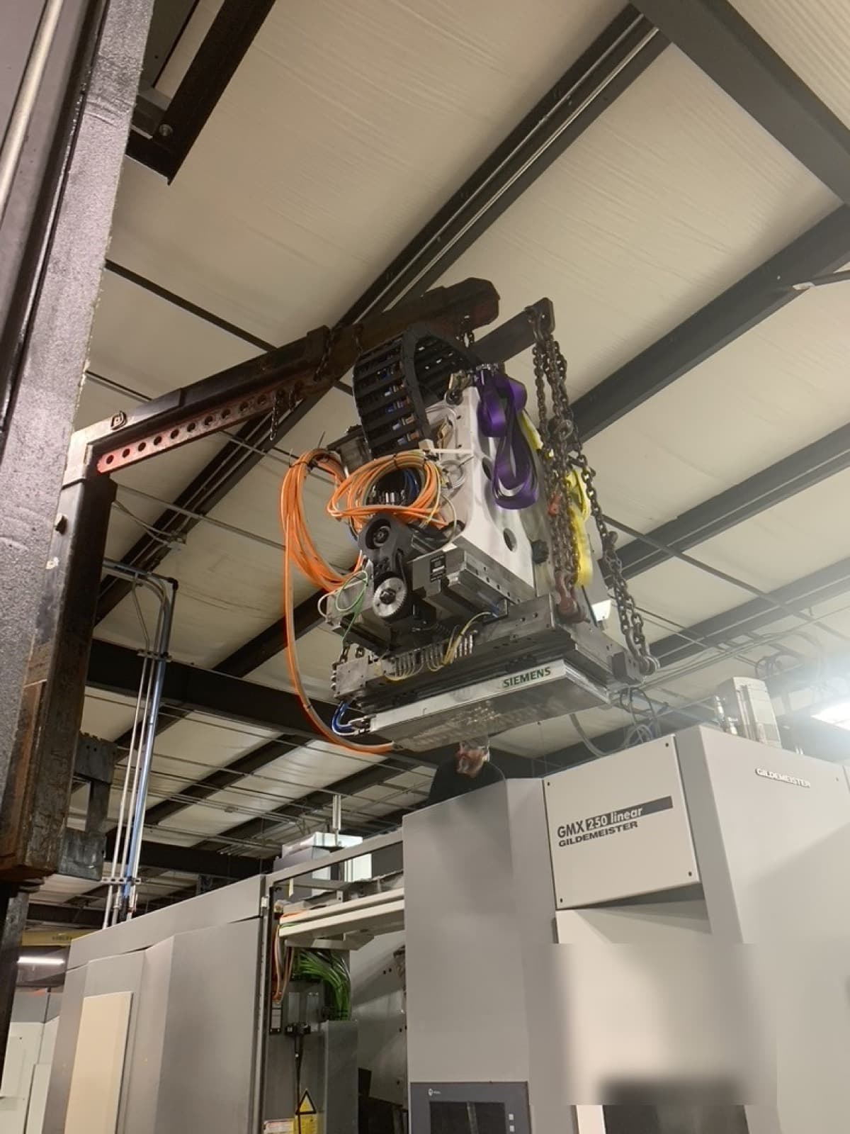 GMX 250 drive tower being craned into the customer's machine